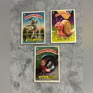 3 VINTAGE 1986 GARBAGE PAIL KIDS CARDS. CRUSHED SHELLY, TRAVELLIN TRAVIS, MARVIN